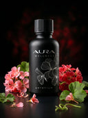 Black bottle of Aura Wellness geranium product with flowers on a dark background